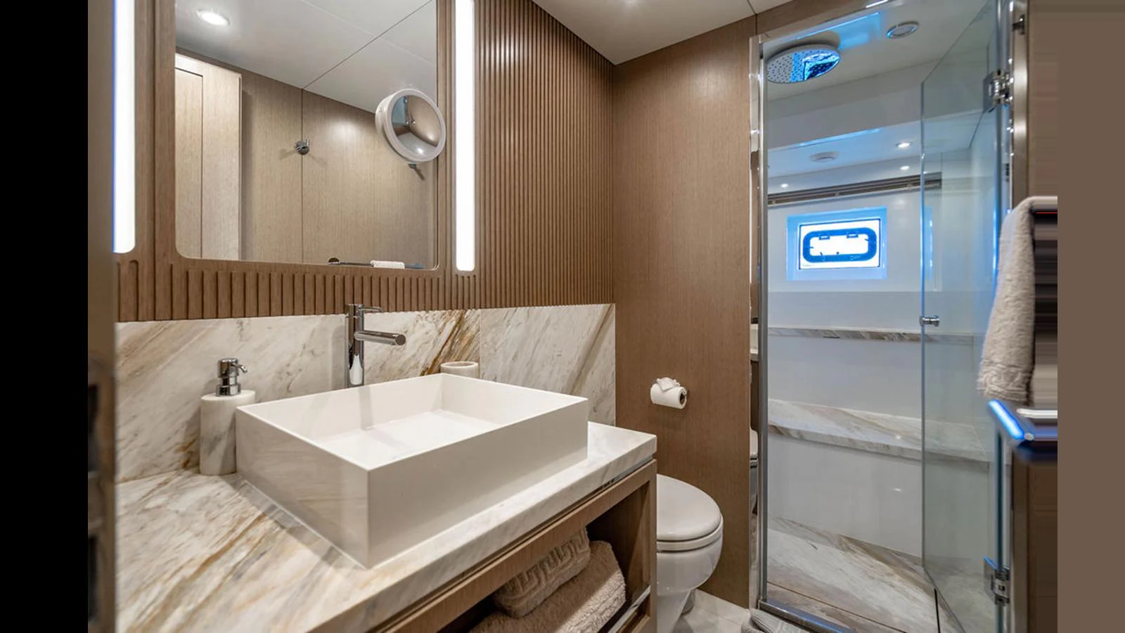 The yacht's bathroom features modern fixtures and elegant marble surfaces. aboard NIVASA Yacht for Sale