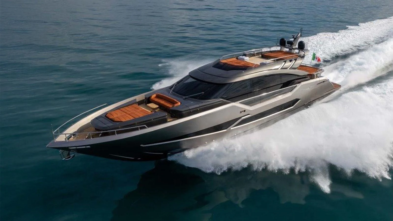 A sleek and modern yacht cruises swiftly on the open water, showcasing its luxurious design and powerful performance. aboard AB 100/05 Yacht for Sale