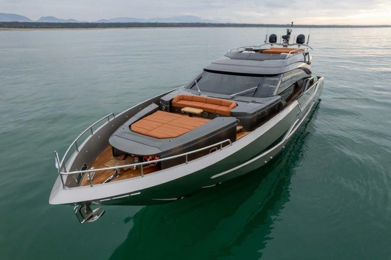 A sleek and modern yacht glides gracefully on calm waters, showcasing its luxurious design and spacious deck. aboard AB 100/05 Yacht for Sale