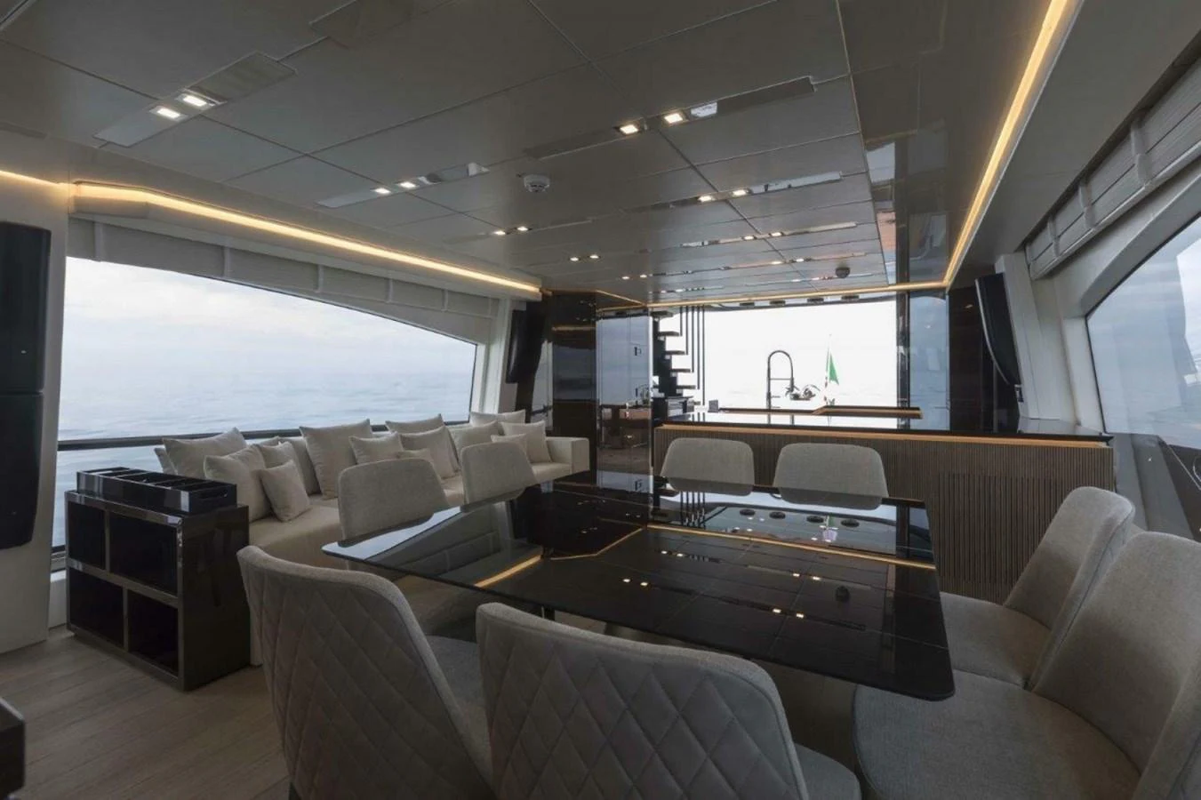 The salon features a spacious and modern design with ample seating and large windows offering panoramic views. aboard AB 100/05 Yacht for Sale