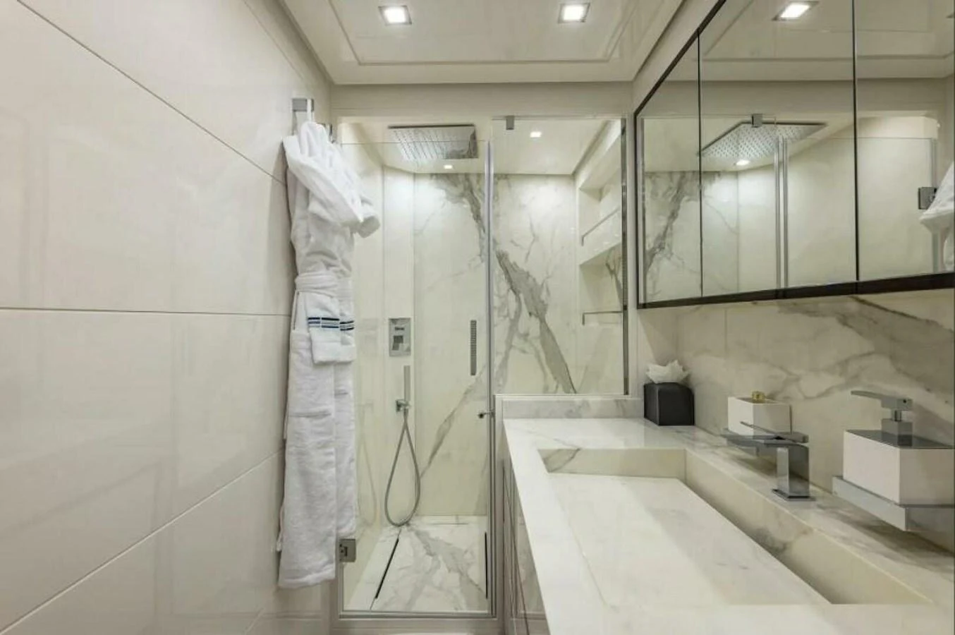 The yacht's bathroom features luxurious marble surfaces and modern fixtures. aboard AB 100/05 Yacht for Sale