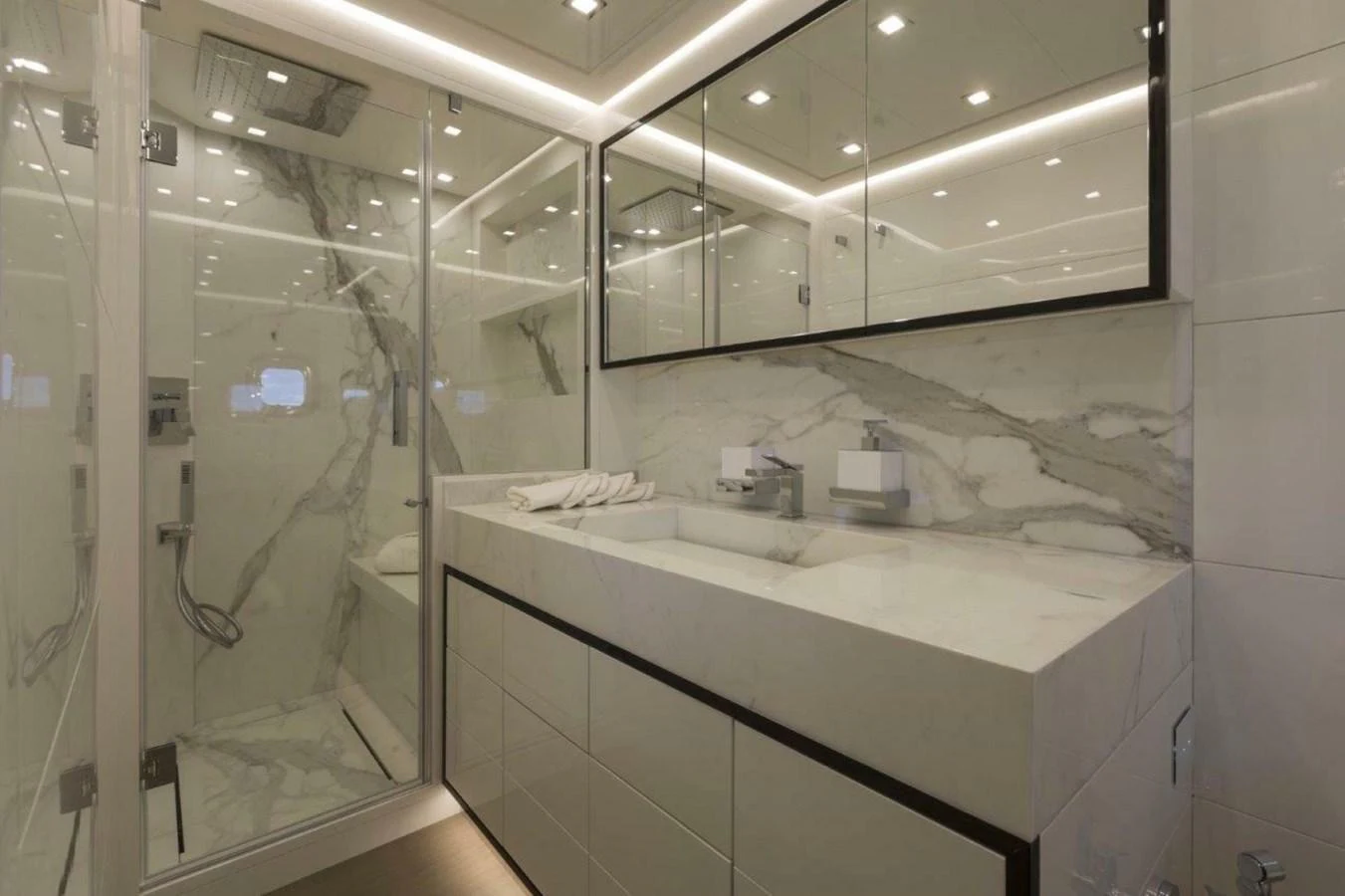 The yacht's bathroom features elegant marble surfaces and modern fixtures. aboard AB 100/05 Yacht for Sale