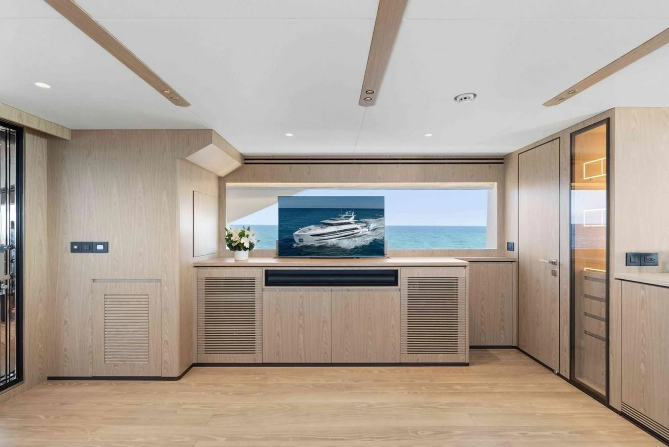 A modern and spacious interior with a large window offering a stunning sea view. aboard THE ROCK Yacht for Sale