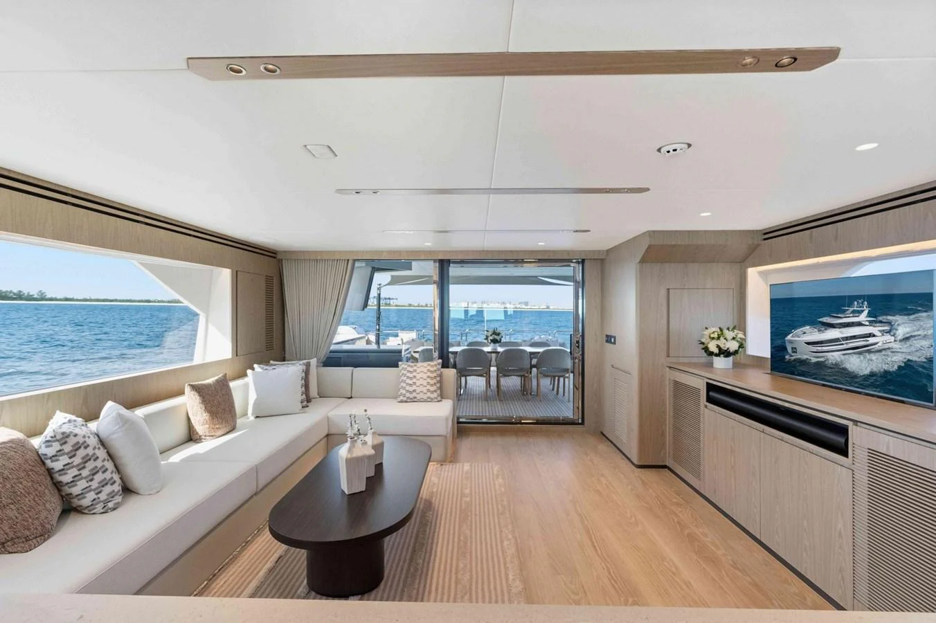 The salon offers a spacious and elegant area with panoramic views and modern furnishings. aboard THE ROCK Yacht for Sale
