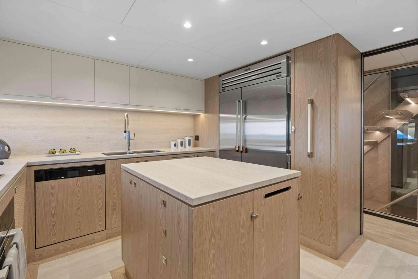 The yacht's galley features modern appliances and ample counter space, perfect for gourmet meal preparation. aboard THE ROCK Yacht for Sale