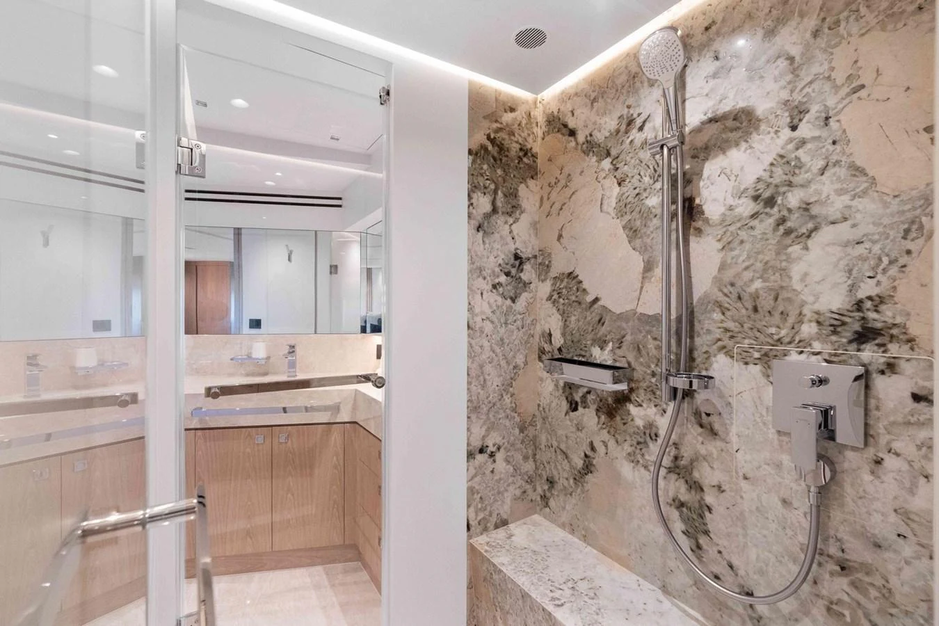 The bathroom features luxurious marble finishes and modern fixtures. aboard THE ROCK Yacht for Sale