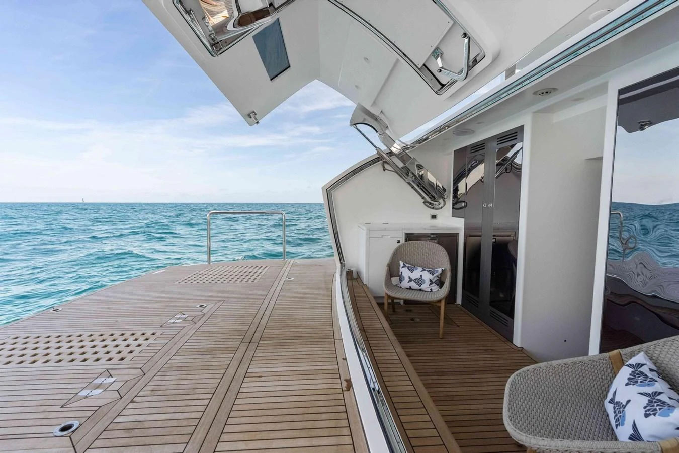The aft deck offers a serene space with comfortable seating and a view of the open sea. aboard THE ROCK Yacht for Sale