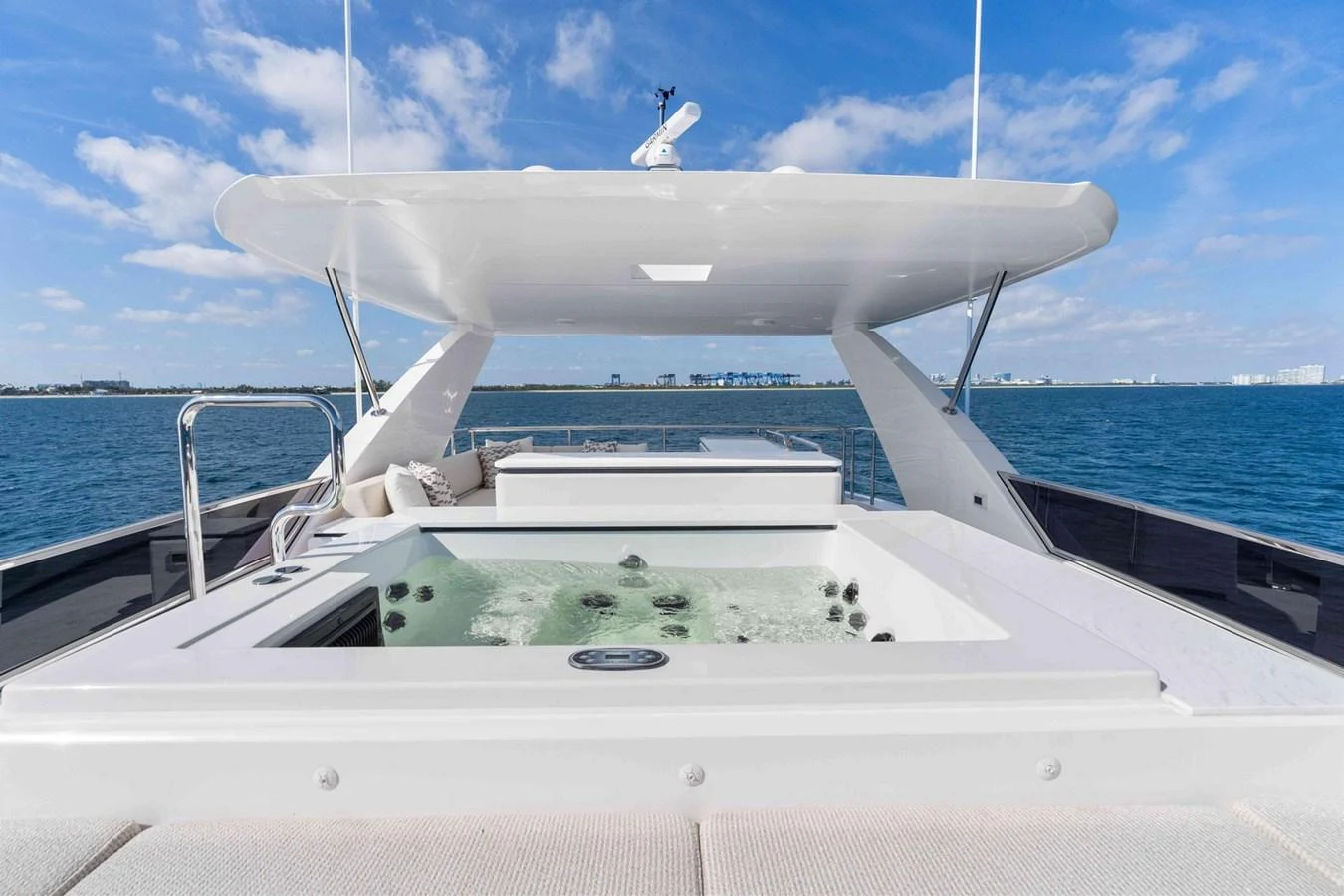 The sundeck features a luxurious hot tub with stunning ocean views. aboard THE ROCK Yacht for Sale
