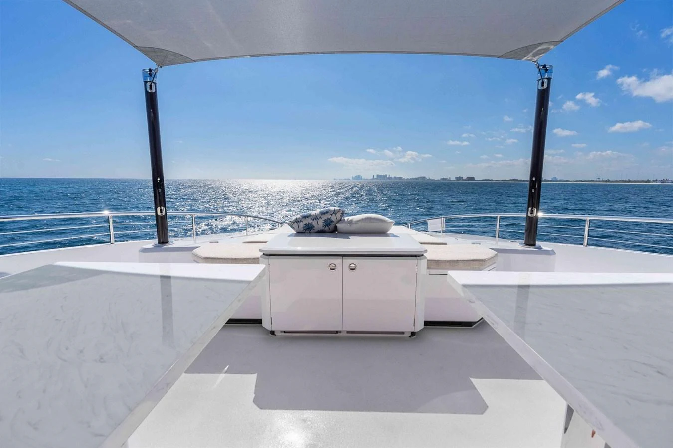 The sundeck offers a serene space with a stunning ocean view, perfect for relaxation. aboard THE ROCK Yacht for Sale