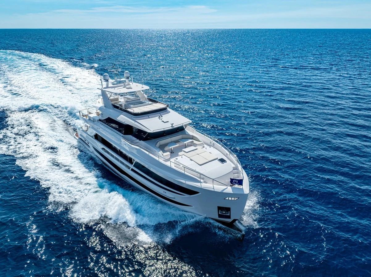 A sleek and modern yacht cruises through the open sea, showcasing its elegant design and powerful performance. aboard THE ROCK Yacht for Sale