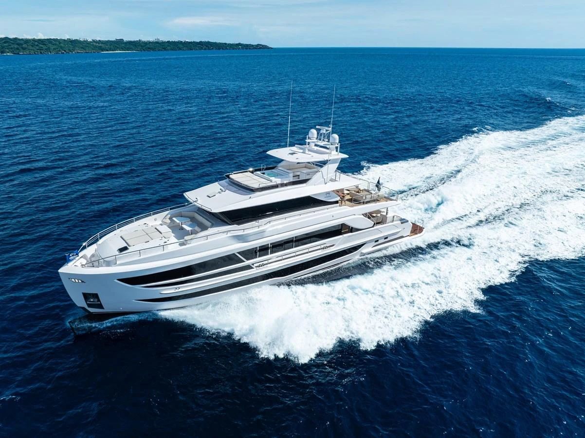 A sleek and modern yacht cruises swiftly through the open sea, showcasing its elegant design and powerful performance. aboard THE ROCK Yacht for Sale