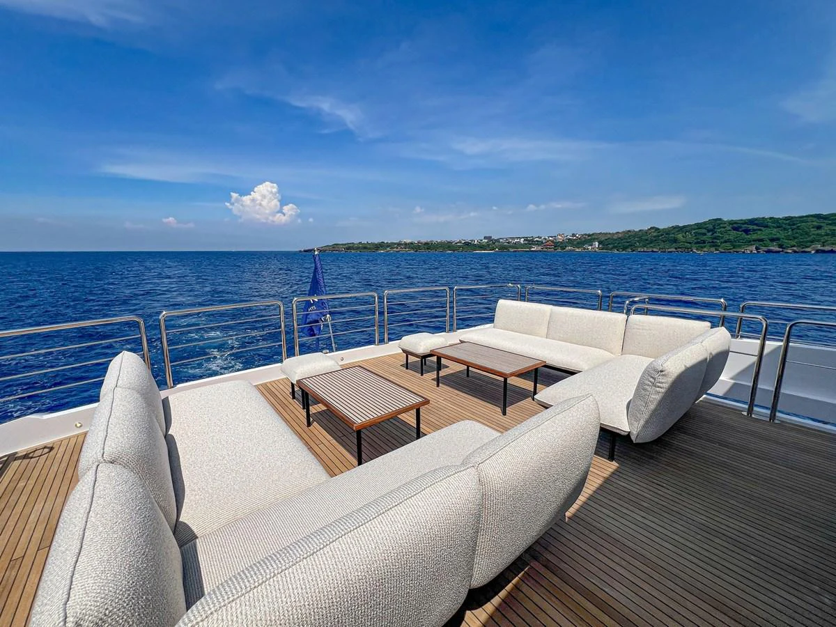 The aft deck offers a luxurious outdoor seating area with stunning ocean views. aboard THE ROCK Yacht for Sale