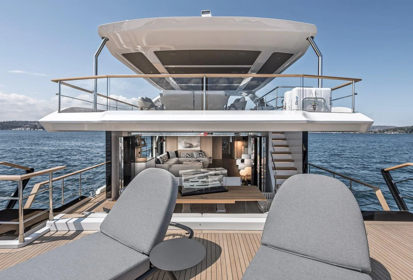 This yacht features a luxurious aft deck with comfortable lounging areas and a seamless transition to the interior living space. aboard NUMARINE 30XP#3 Yacht for Sale
