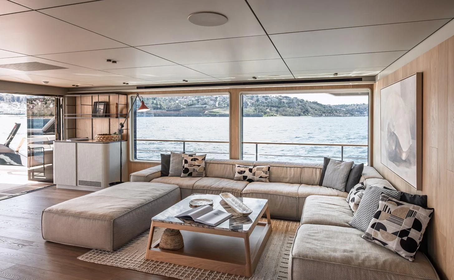 The salon features a spacious and elegantly designed seating area with panoramic views of the water. aboard NUMARINE 30XP#3 Yacht for Sale