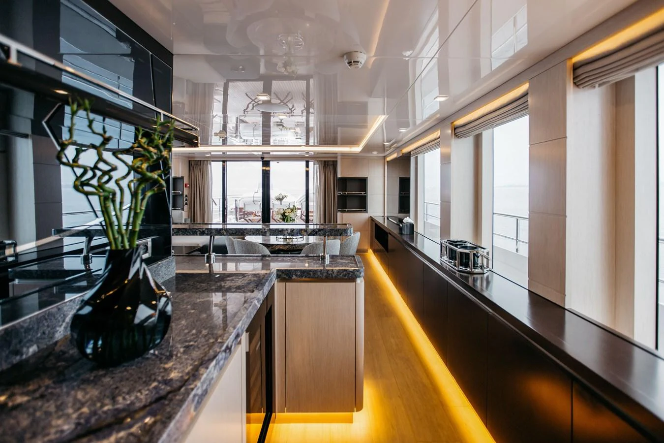 The yacht's galley features modern design with sleek surfaces and ample natural light. aboard BERING 145 Yacht for Sale