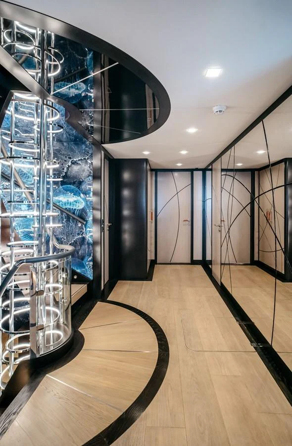 A luxurious hallway with modern lighting and elegant design elements. aboard BERING 145 Yacht for Sale