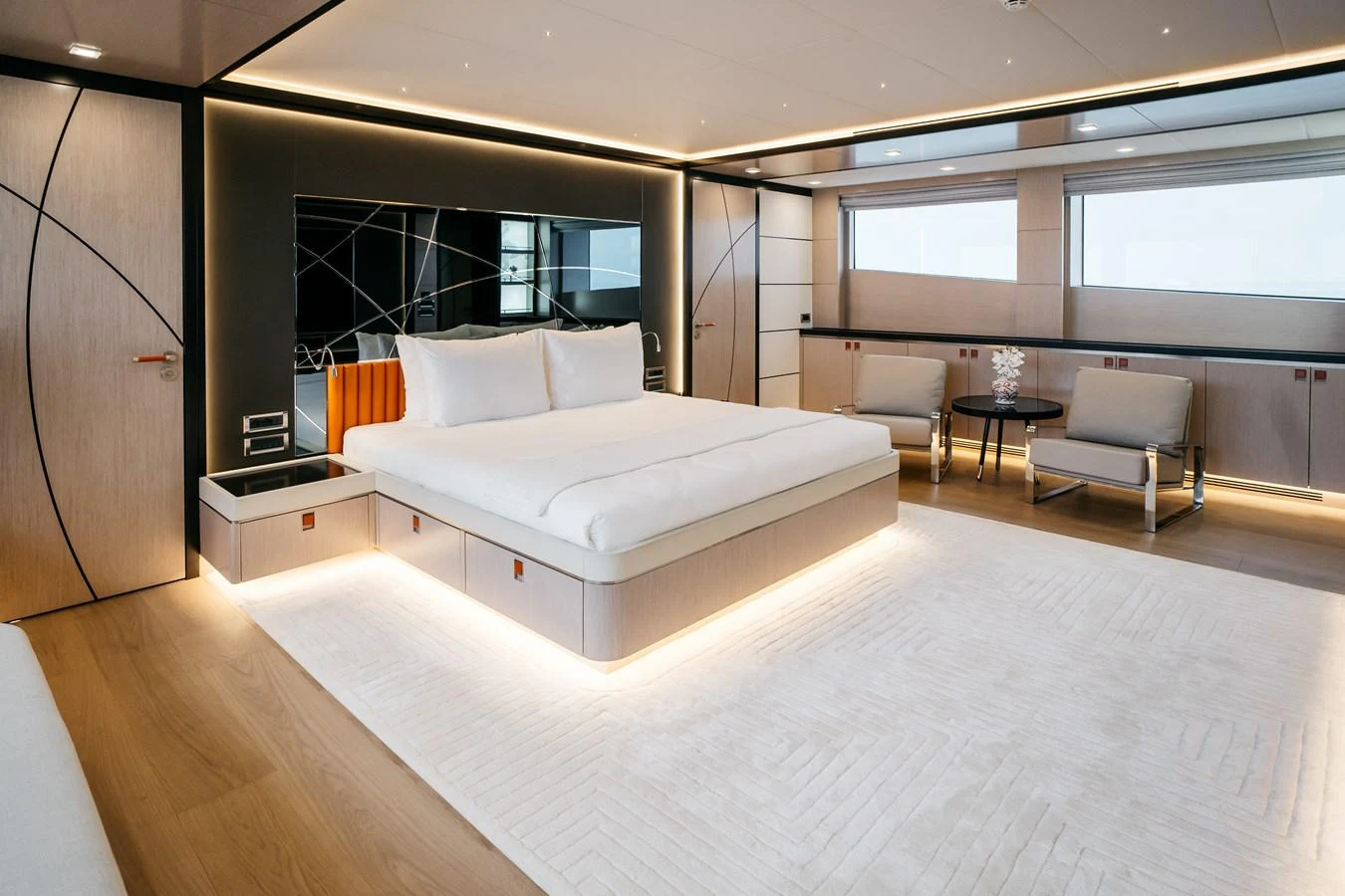 The master stateroom features a spacious bed, modern furnishings, and large windows for natural light. aboard BERING 145 Yacht for Sale
