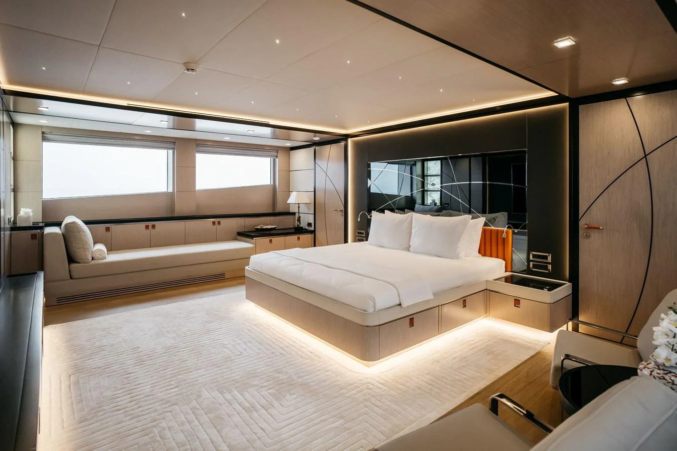 The master stateroom features a luxurious bed, elegant lighting, and modern furnishings. aboard BERING 145 Yacht for Sale