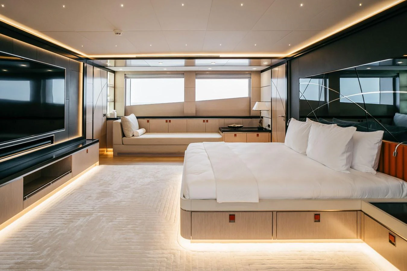 The master stateroom features a luxurious bed, ample natural light, and modern furnishings. aboard BERING 145 Yacht for Sale