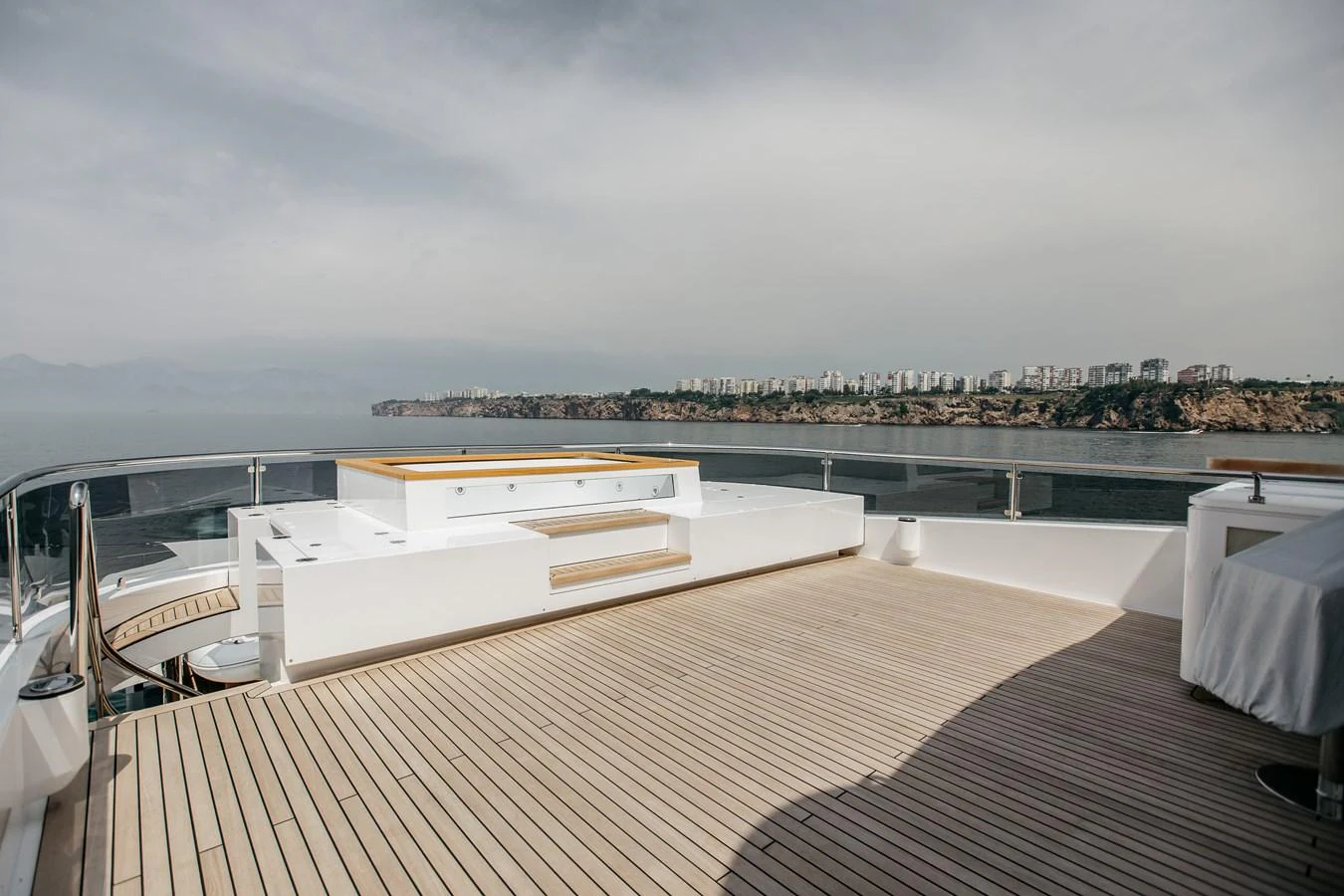 The yacht's sundeck offers a spacious and serene area for relaxation with stunning views. aboard BERING 145 Yacht for Sale