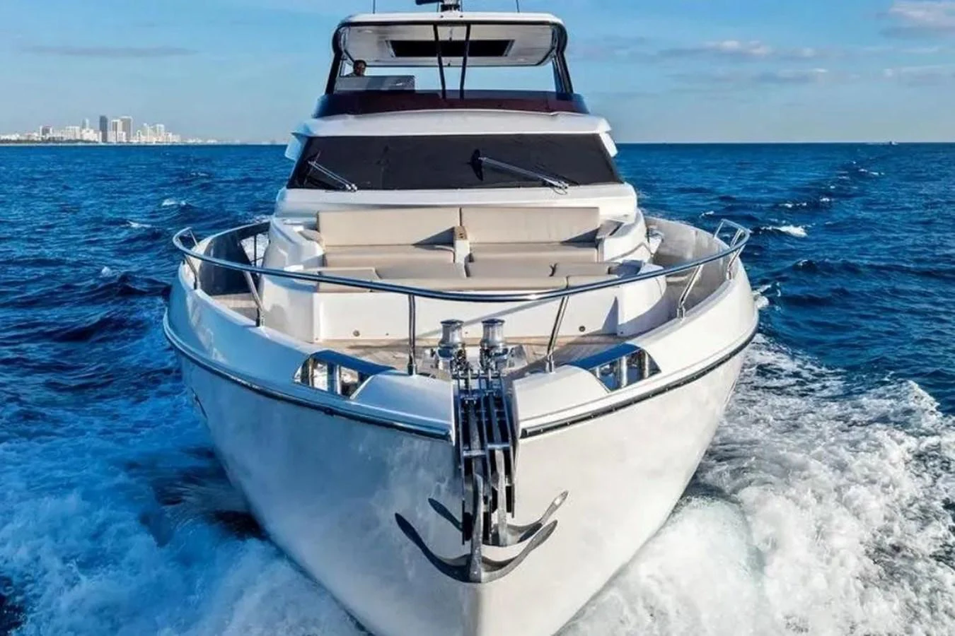 A sleek yacht cruises through the open water, showcasing its modern design and luxurious amenities. aboard SAVIENNE Yacht for Sale