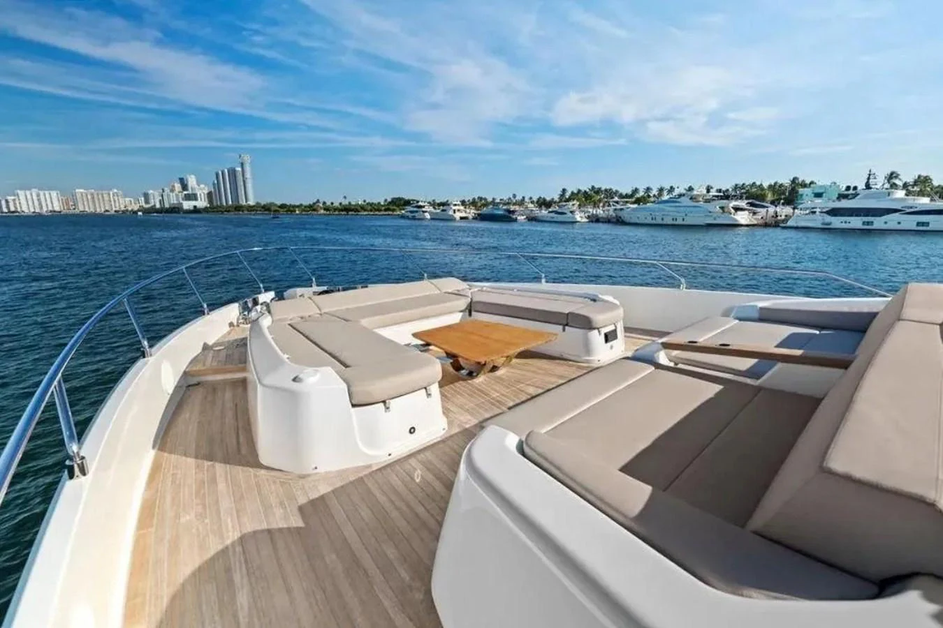 The foredeck offers spacious sun pads and a central table, perfect for relaxation and socializing. aboard SAVIENNE Yacht for Sale