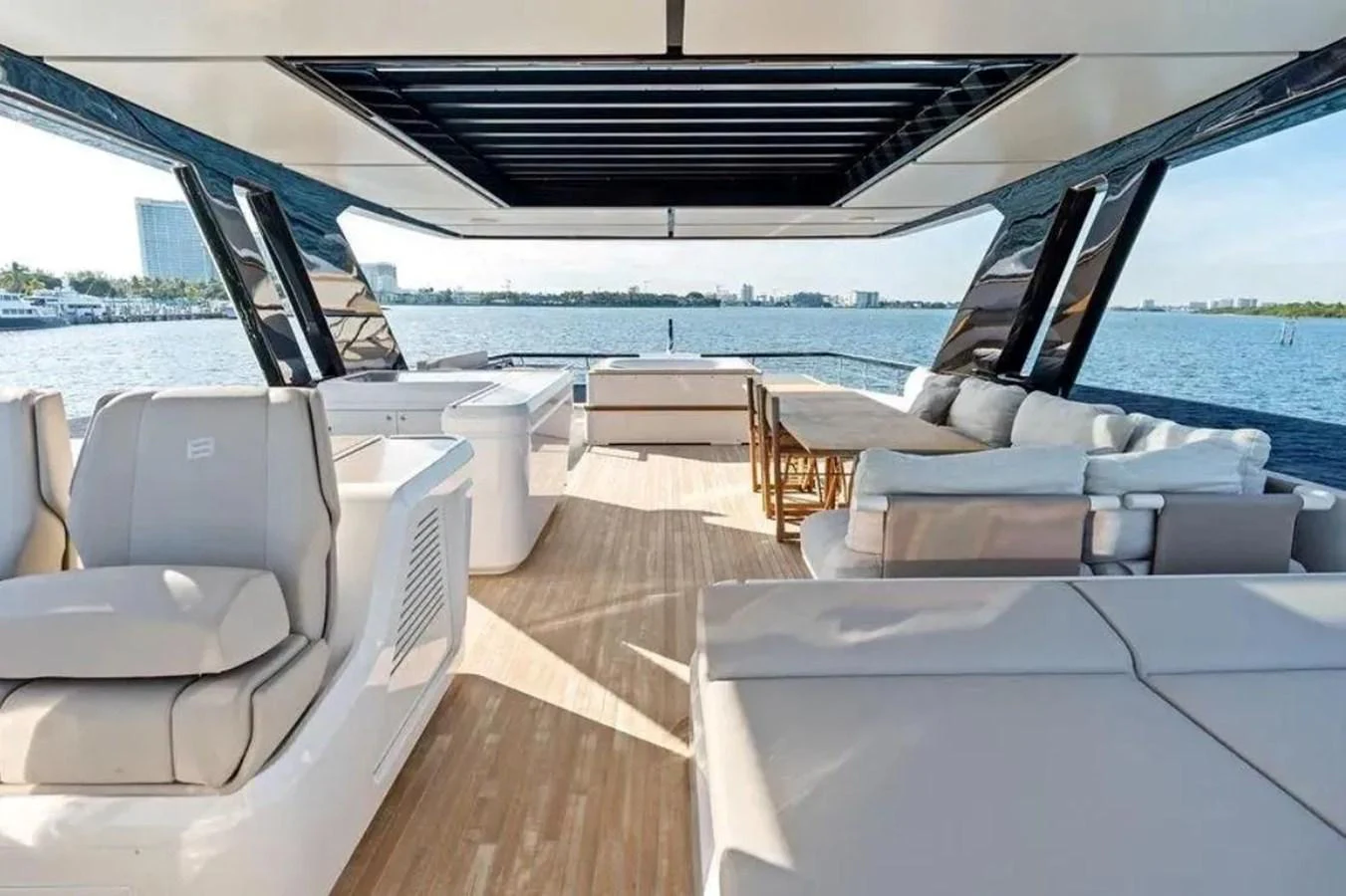 The aft deck offers a spacious and luxurious outdoor seating area with stunning views of the water. aboard SAVIENNE Yacht for Sale