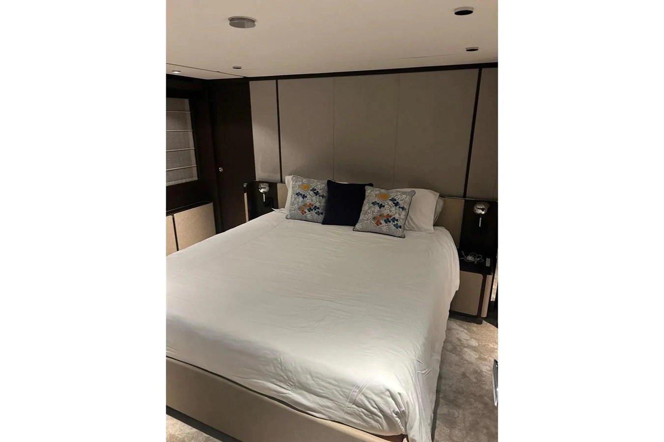 A luxurious stateroom featuring a large, comfortable bed with elegant bedding. aboard SAVIENNE Yacht for Sale