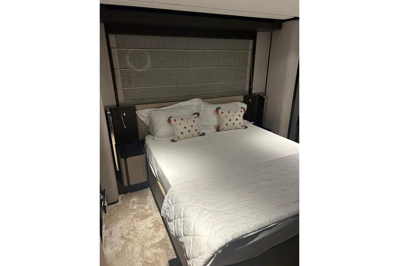 The stateroom features a comfortable bed with plush pillows and modern decor. aboard SAVIENNE Yacht for Sale