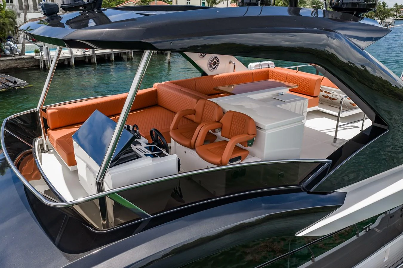 The flybridge features a sleek design with comfortable seating and a modern helm station. aboard ELENA Yacht for Sale