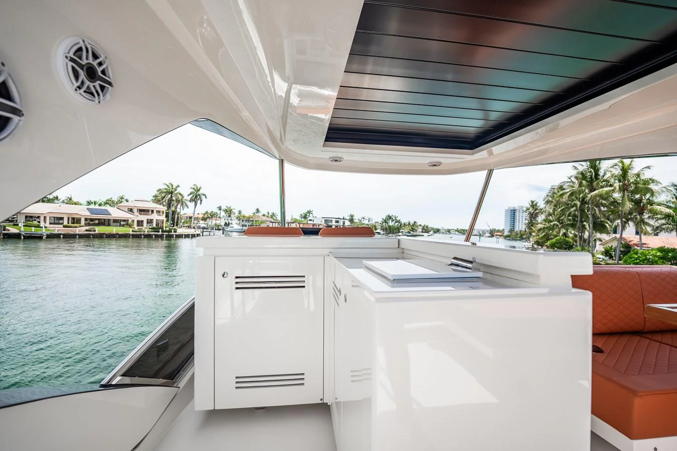 The flybridge offers a sleek and modern space with ample seating and a view of the serene waterfront. aboard ELENA Yacht for Sale