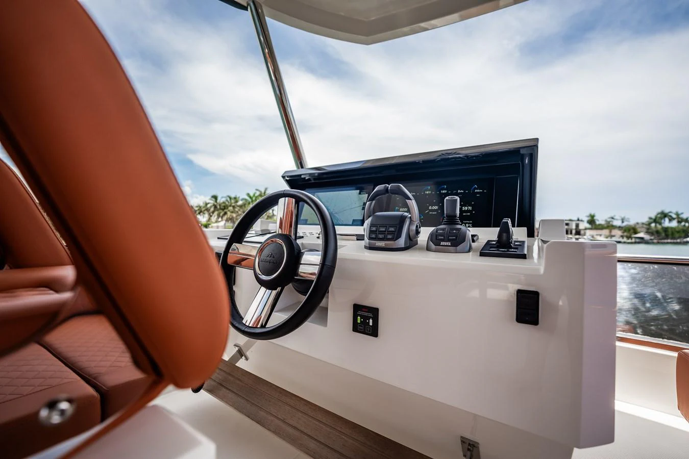 The helm station features modern navigation equipment and a comfortable captain's chair. aboard ELENA Yacht for Sale