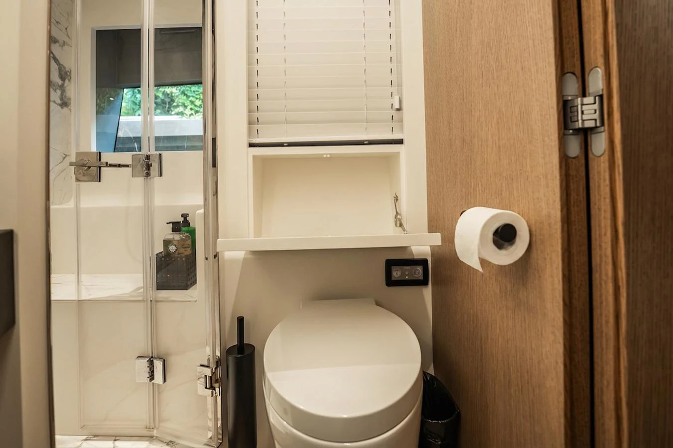 The yacht's bathroom features a modern design with a glass-enclosed shower and sleek fixtures. aboard ELENA Yacht for Sale