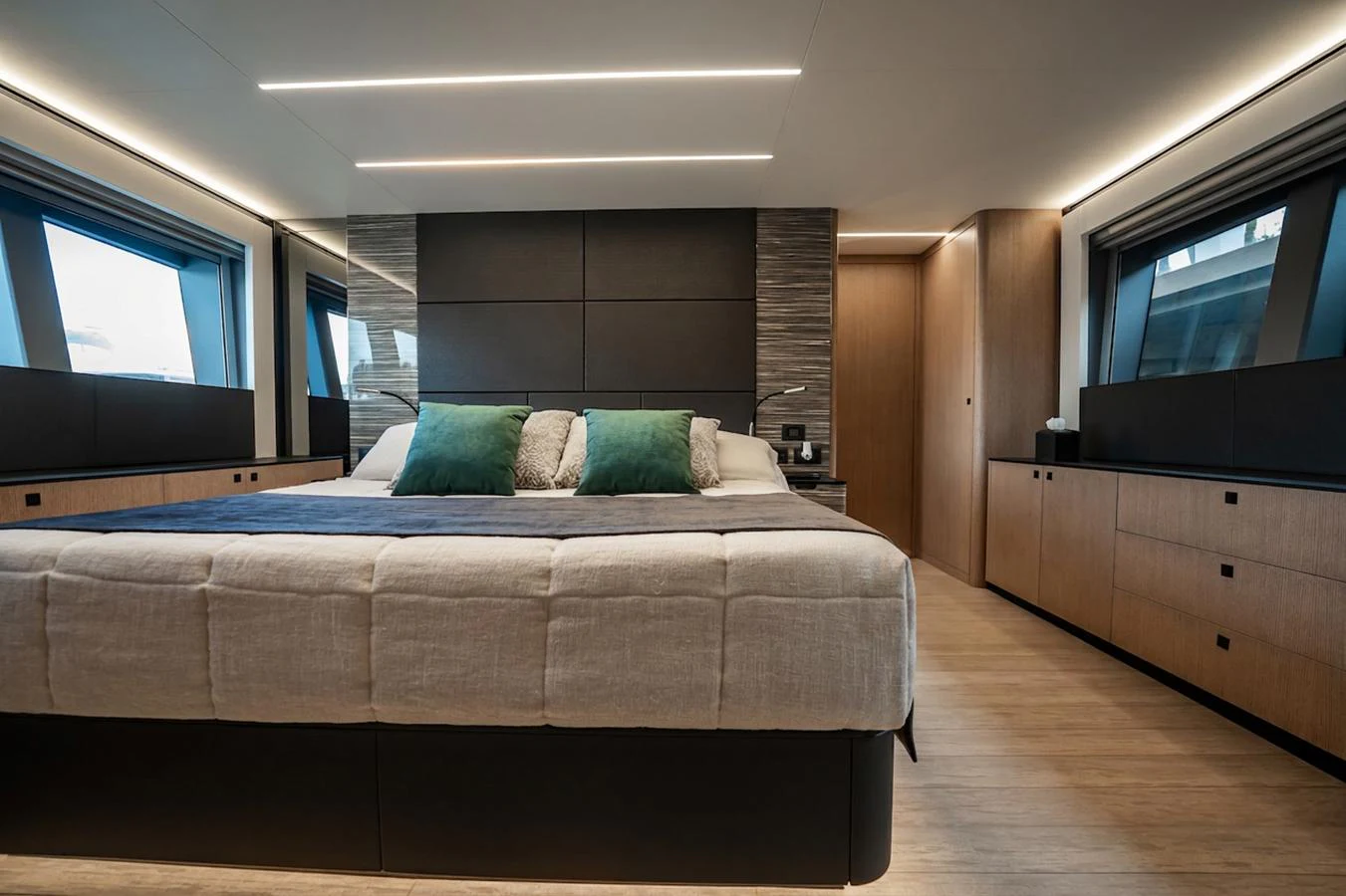 The master stateroom features a luxurious bed with modern decor and ample natural light. aboard ELENA Yacht for Sale