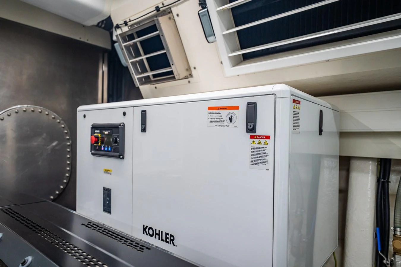 The image showcases the yacht's engine room with a Kohler generator. aboard ELENA Yacht for Sale