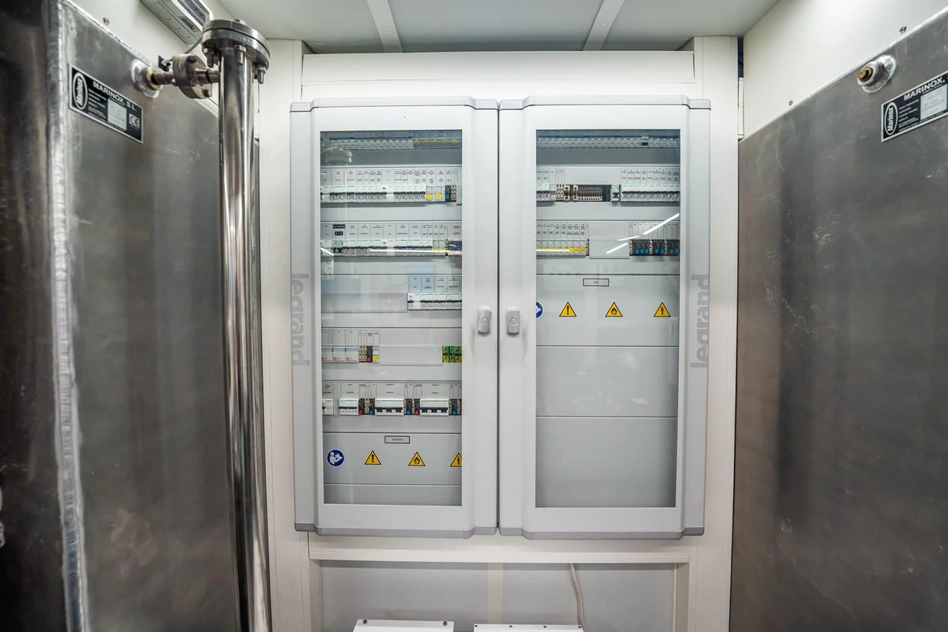 The image showcases the yacht's engine room with electrical panels and control systems. aboard ELENA Yacht for Sale