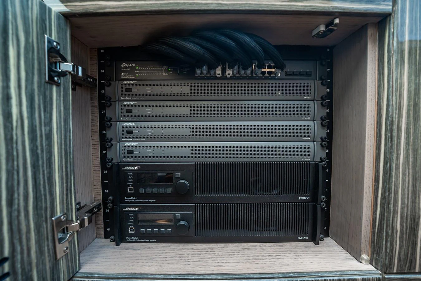 The image showcases the yacht's advanced audio-visual equipment neatly installed in a cabinet. aboard ELENA Yacht for Sale