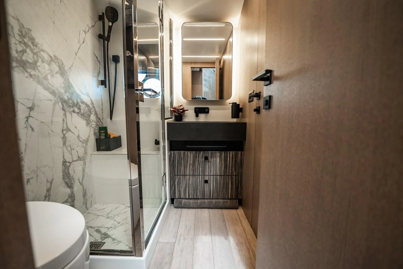 The yacht's bathroom features modern fixtures and elegant marble accents. aboard ELENA Yacht for Sale
