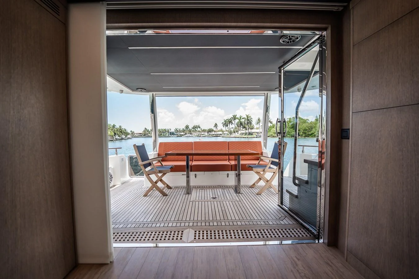 The aft deck offers a seamless transition to the outdoors with comfortable seating and a stunning view. aboard ELENA Yacht for Sale