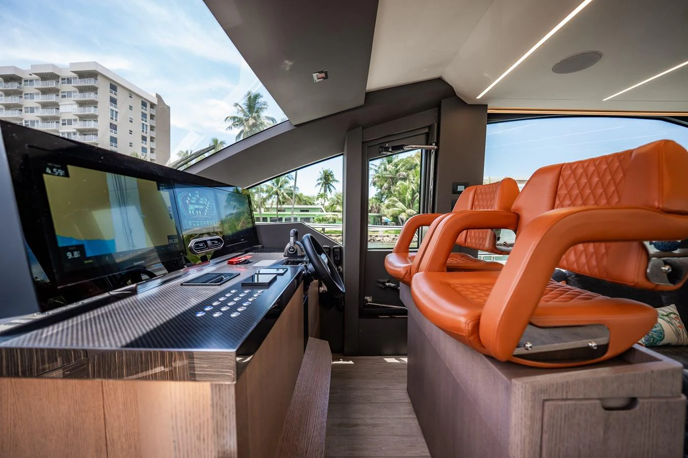 The helm station features modern navigation equipment and luxurious seating with a view of the surroundings. aboard ELENA Yacht for Sale