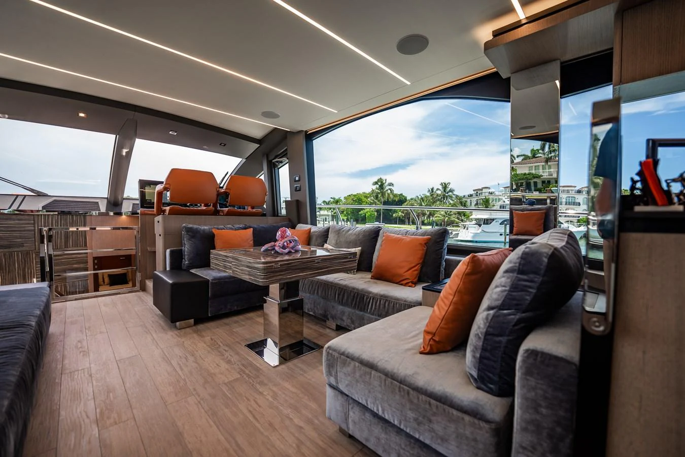 The salon features plush seating, a modern design, and expansive windows offering stunning views. aboard ELENA Yacht for Sale