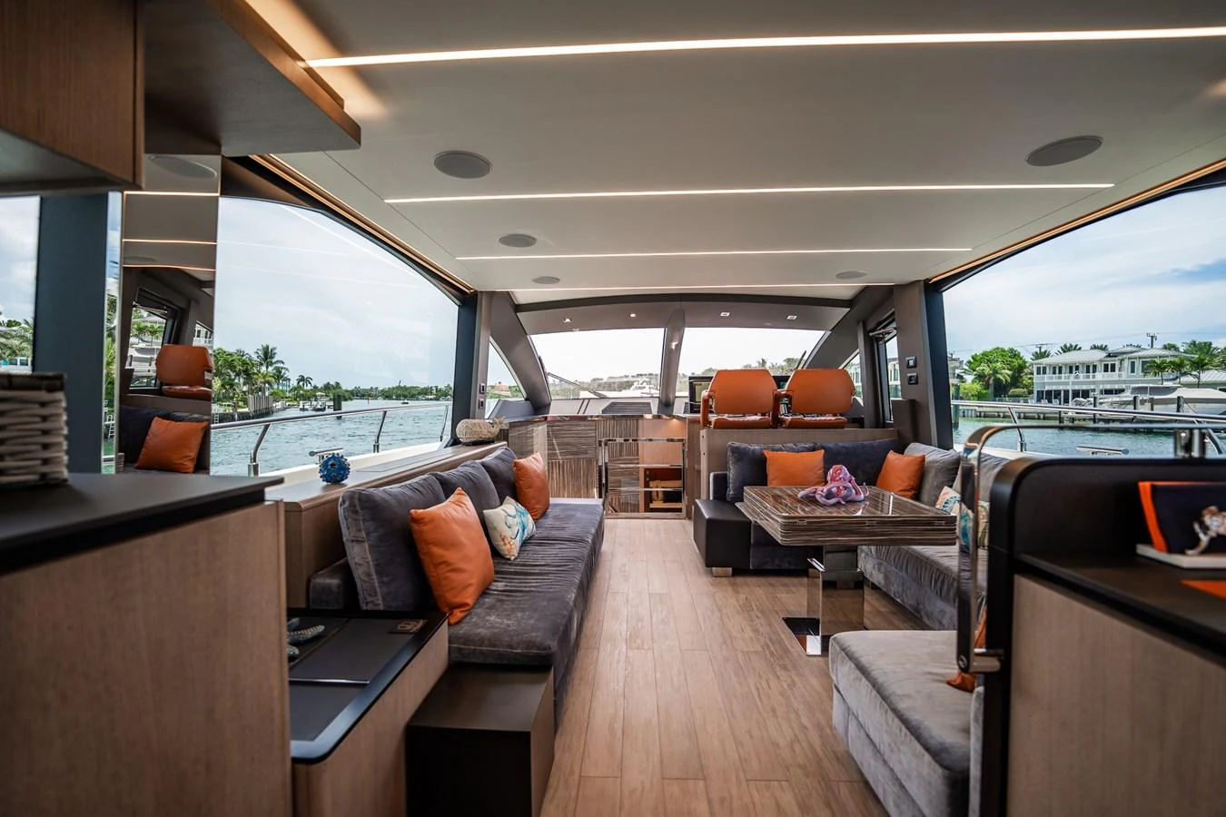 The yacht's salon features modern furnishings with ample natural light and a comfortable seating area. aboard ELENA Yacht for Sale