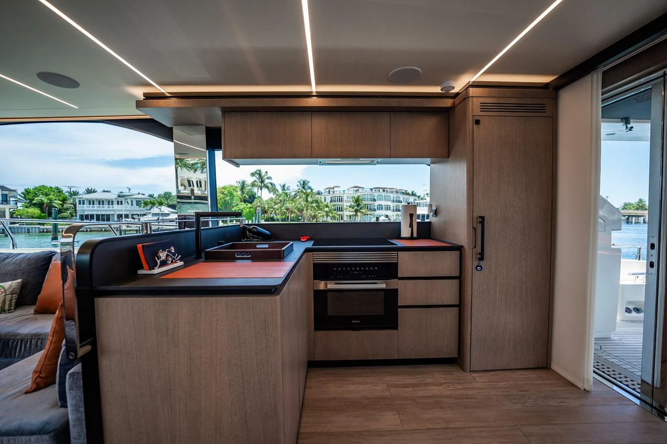 The yacht's galley features modern appliances and a sleek design with a view of the water. aboard ELENA Yacht for Sale