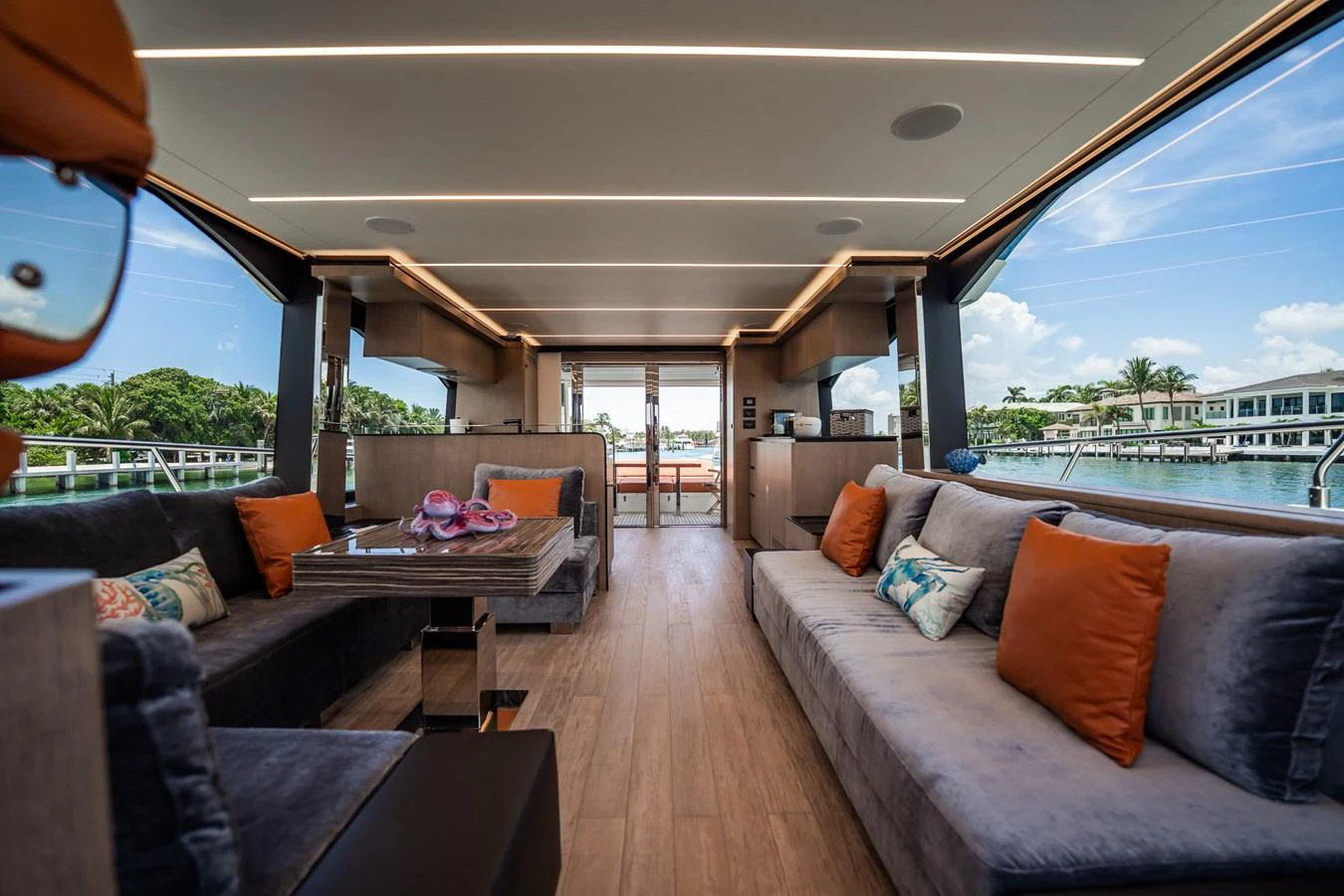 The salon offers a spacious and luxurious seating area with panoramic views of the water. aboard ELENA Yacht for Sale