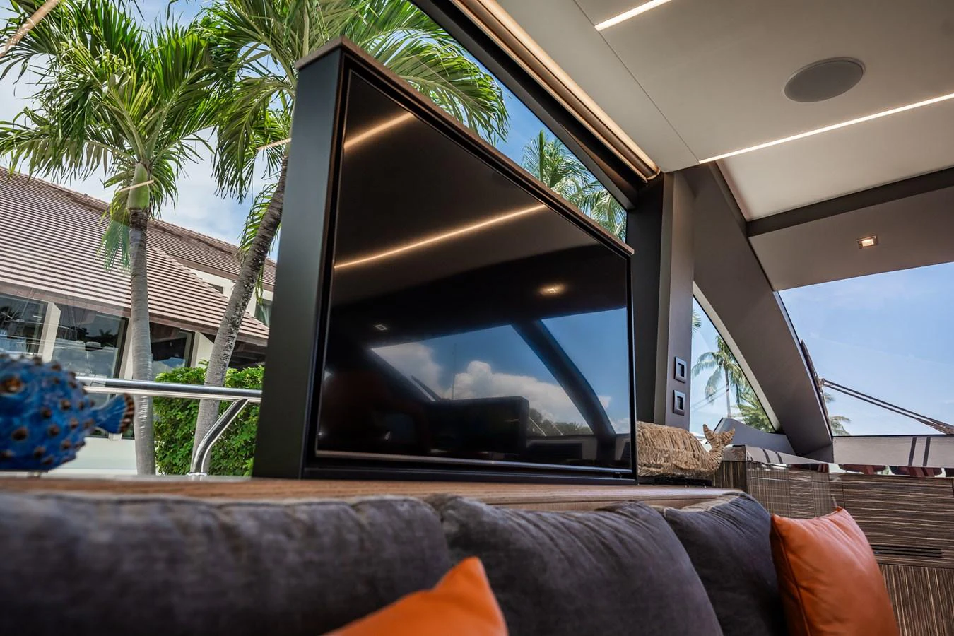 The yacht's interior features a cozy seating area with a large flat-screen TV and views of the outdoors. aboard ELENA Yacht for Sale