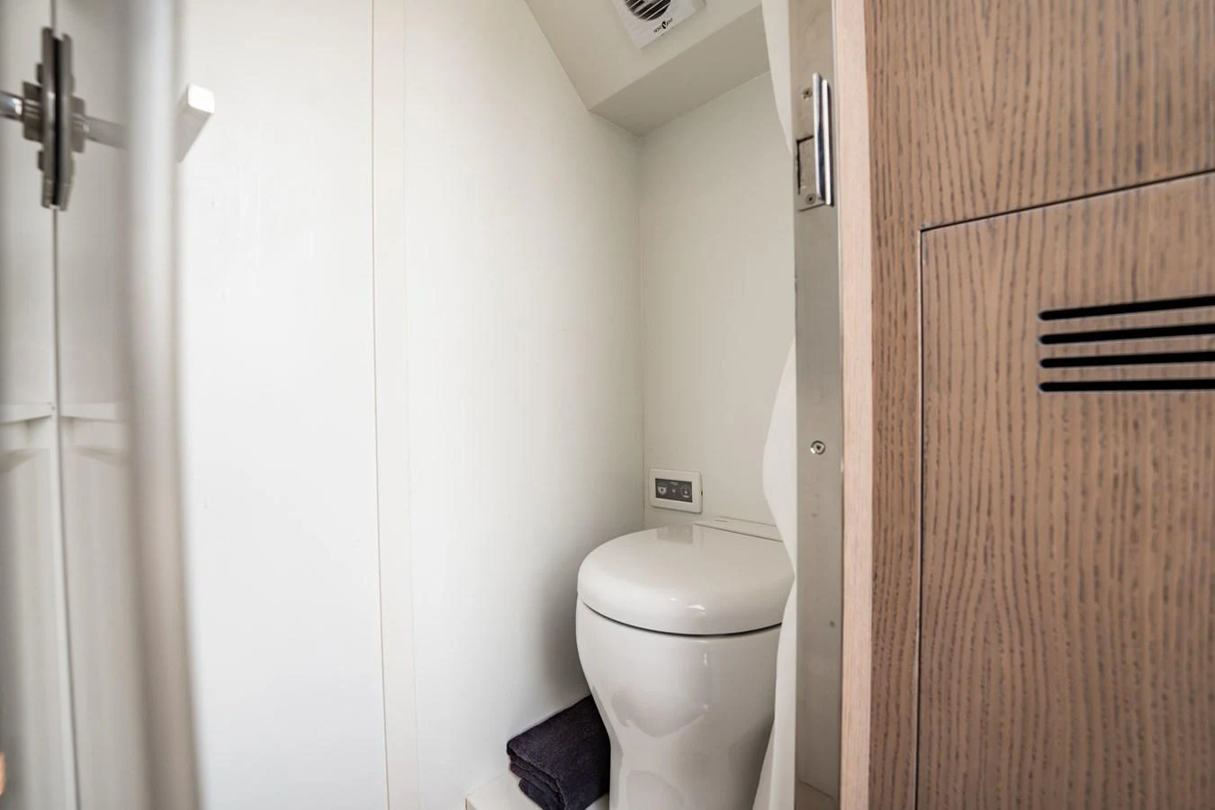 The image shows a compact and modern yacht bathroom with a sleek design. aboard ELENA Yacht for Sale