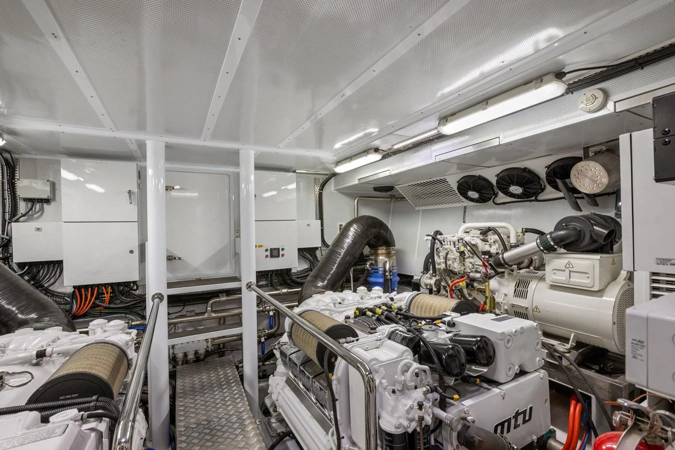 The engine room showcases the yacht's powerful and well-maintained machinery. aboard WARREN 87 Yacht for Sale