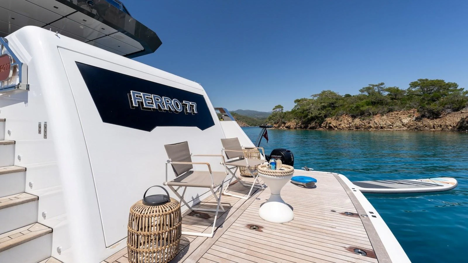 The aft deck of the yacht offers a serene spot for relaxation with comfortable seating and a beautiful view of the surrounding waters. aboard FERRO 77 Yacht for Sale