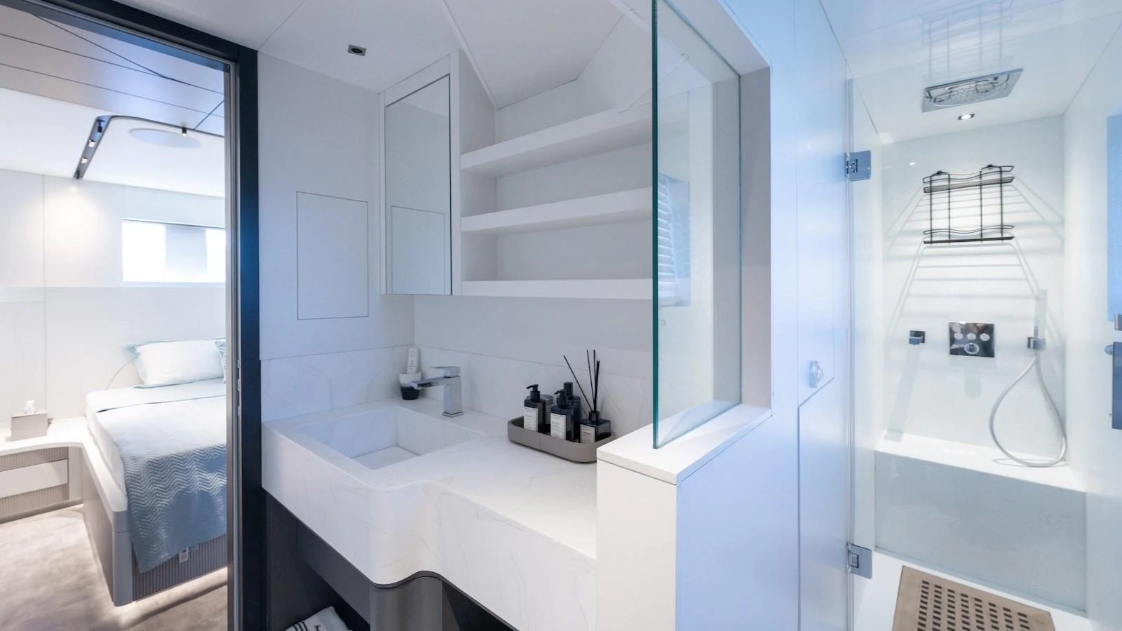 The yacht's bathroom features a sleek, modern design with a spacious shower and elegant fixtures. aboard FERRO 77 Yacht for Sale