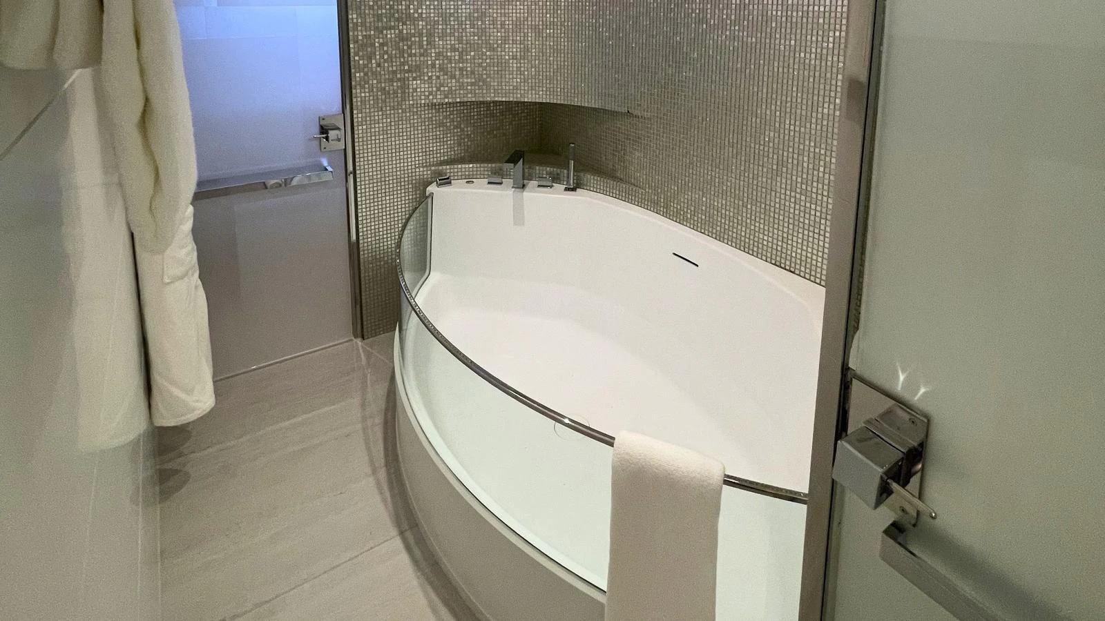 The yacht's bathroom features a modern bathtub with sleek fixtures and a glass partition. aboard ELENI 60M Yacht for Sale